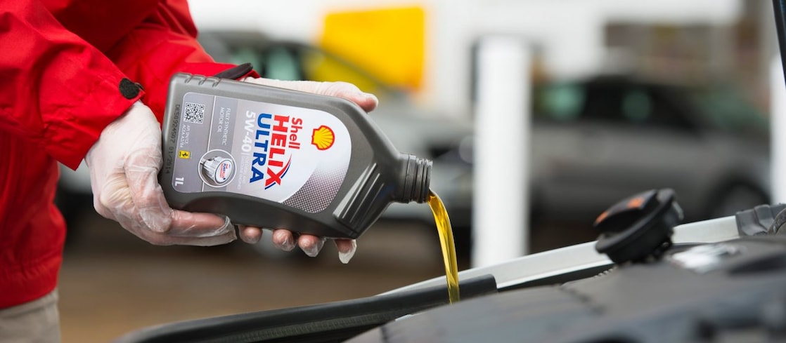 Shell Helix Ultra being poured into an engine
