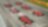 Collection of red ferrari cars on starting grid