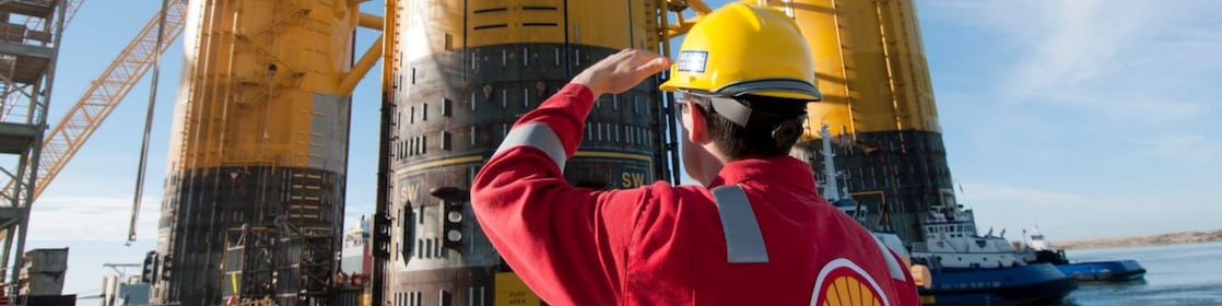 Engineer looking up at platform under construction