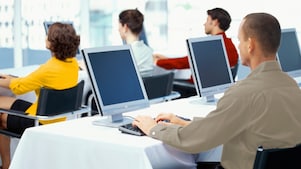 Employees using computers in an office