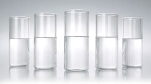 Five beakers in a row with a clear liquid in each one