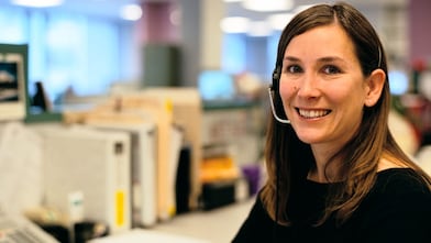 Women in office with head set on