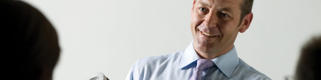 Man presenting at a meeting