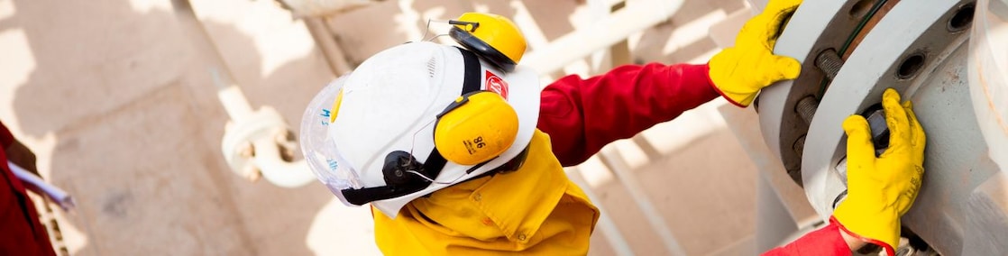 Worker wearing safety mask and gloves
