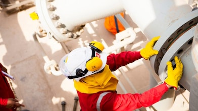 Worker wearing safety mask and gloves