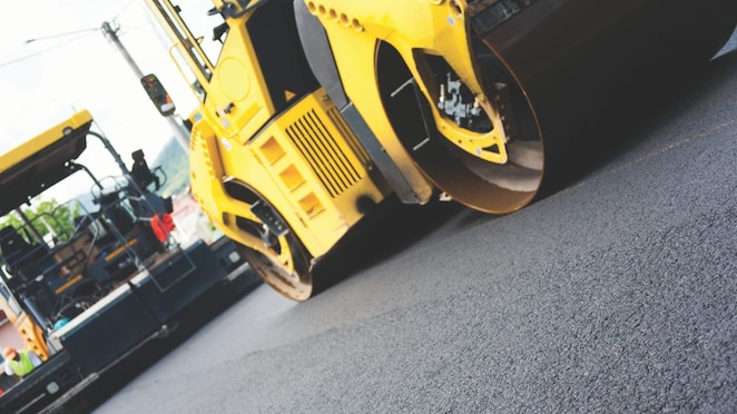 Road roller paving the road