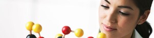 scientist looking at molecule model