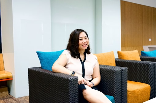 Ching taking a break at office as she sits and rests a bit
