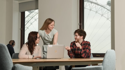 Shell employees in London huddled around a laptop.