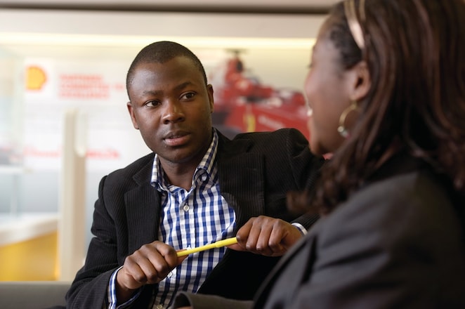 two individuals discussing