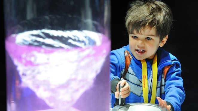 A child interacts with an exhibit in the Shell Eco Marathon Experience on day two of the Shell Eco-marathon Americas 2015 in Detroit, Mich., Saturday, April 11, 2015.