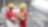 Shot of two workers in hardhats discussing a project in a refinery