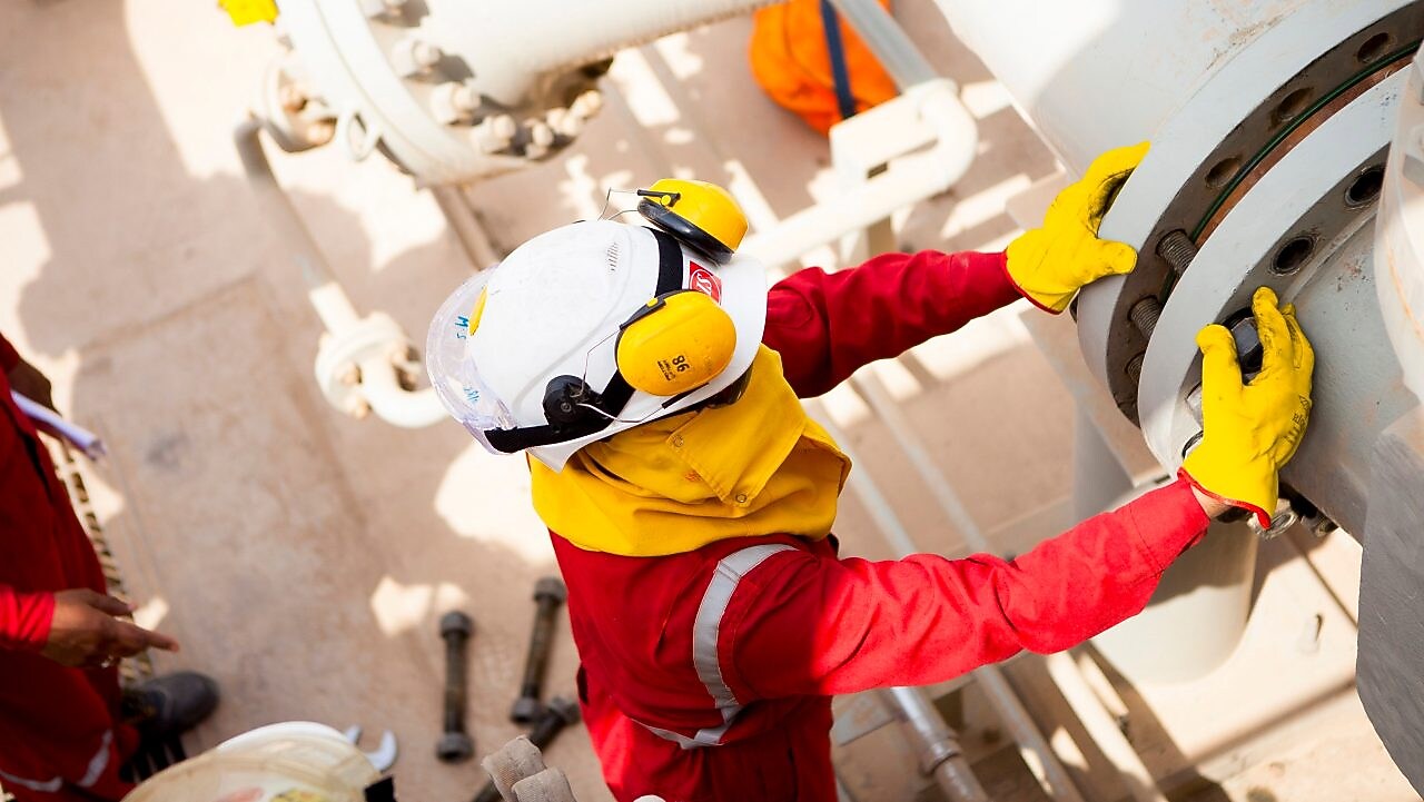 Worker wearing safety mask and gloves