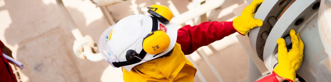Worker wearing safety mask and gloves