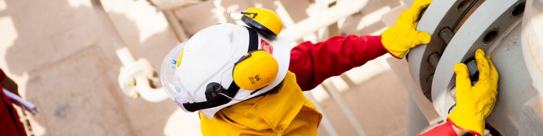 Worker wearing safety mask and gloves