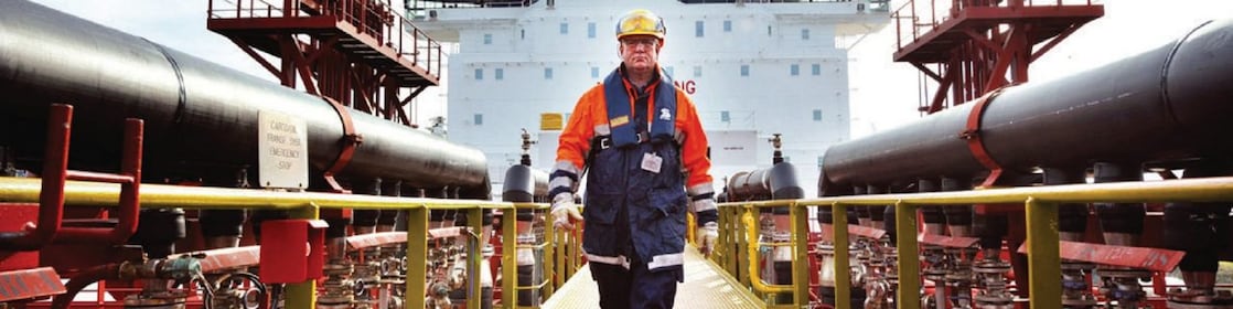 worker walking around a Shell vessel