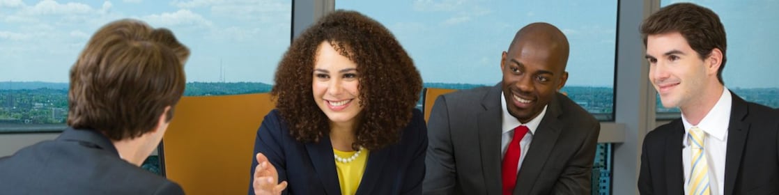 four shell employees in a meeting 