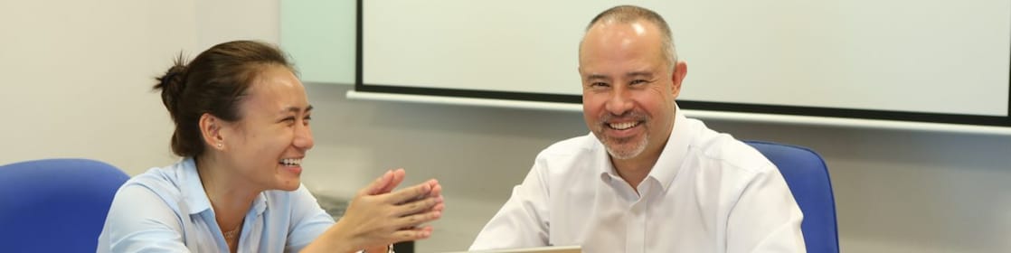 Shell graduate Inah Felisse Margaja with her mentor Scott Low having a discussion in a meeting room