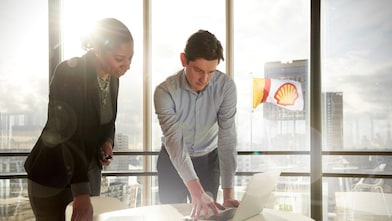 Shell intern discussing plans with his manager