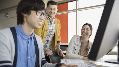 High school students and teacher in computer lab