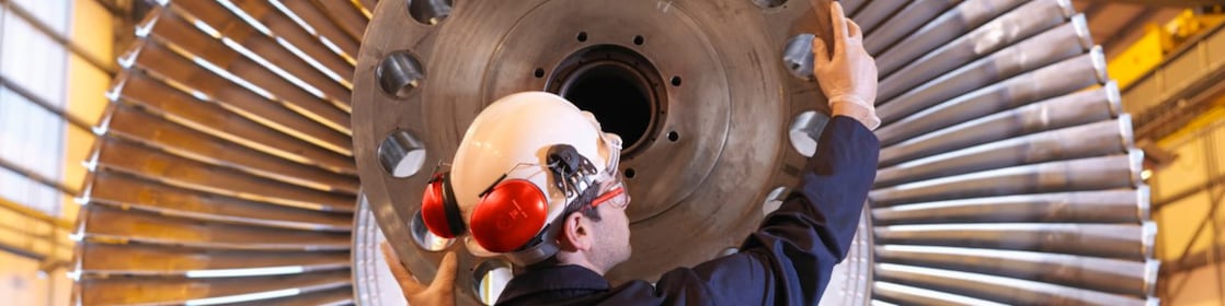 Engineer Inspecting Turbine