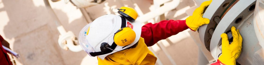 Worker wearing safety mask and gloves