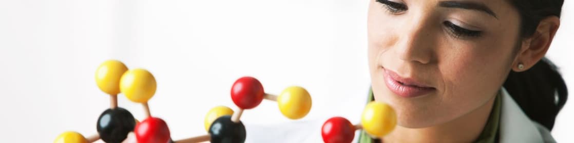 scientist looking at molecule model