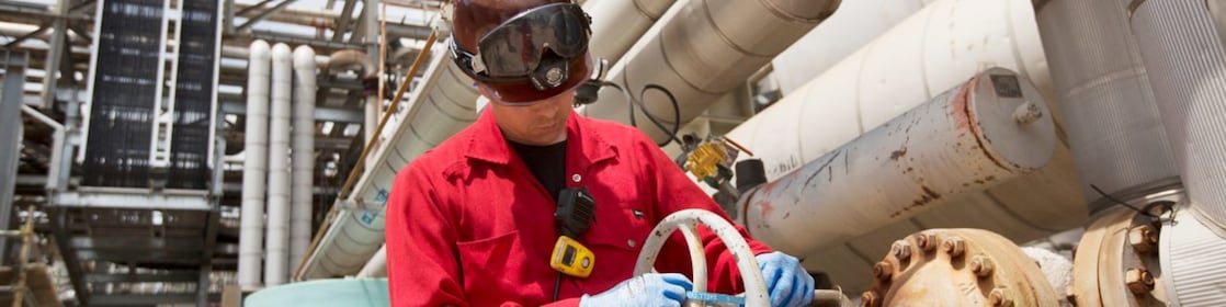 An engineer checks platform equipment for safety
