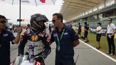 ATC rider talking to pit crew