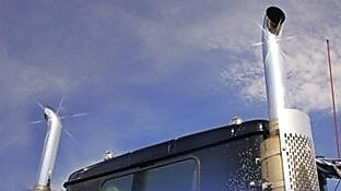 Roof and top of a truck showing exhaust pipes