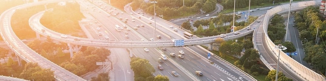 Cars driving on a complicated highway infrastructure with over and under passes