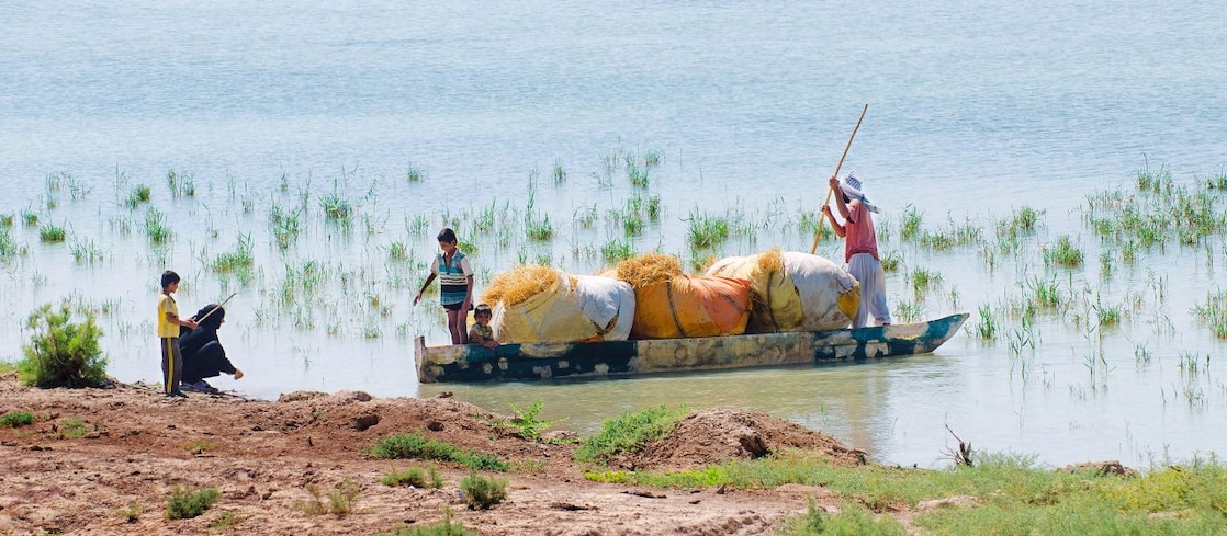 Local people on the Yabani Canal in the South of Iraq